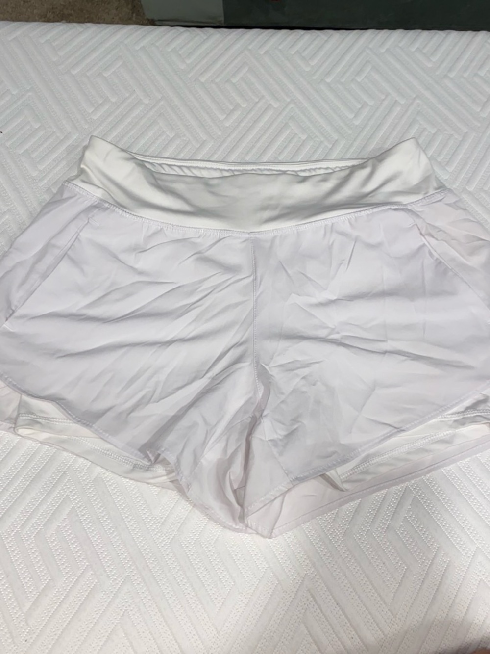 Bundle set of three pairs of athletic shorts. (White, tan, navy)